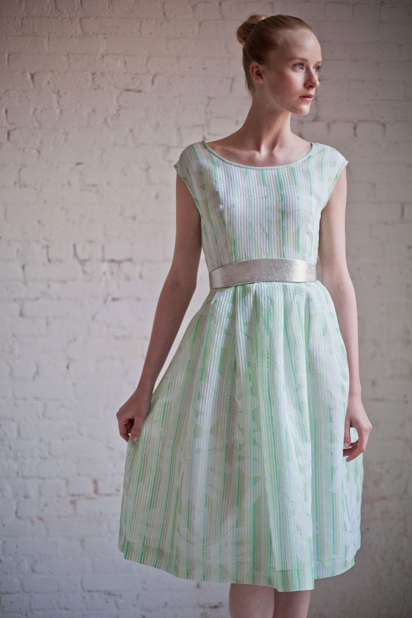 green and white pleated midi dress