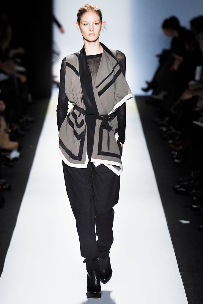 gray layered top with black pants