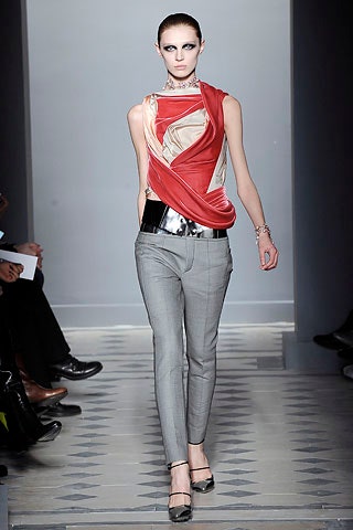 fitted red silk top with gray pants