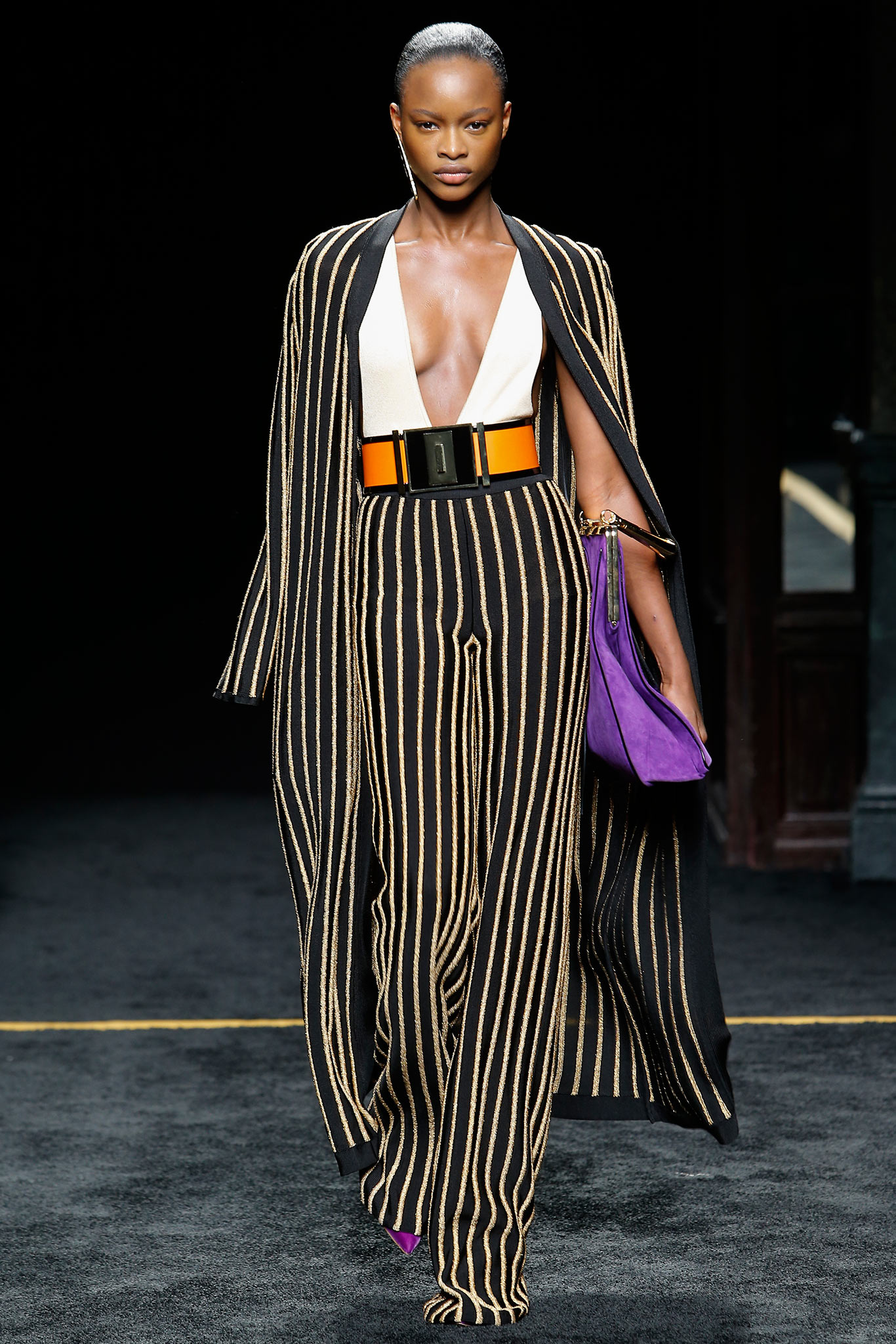 black and gold striped jacket with fitted pants