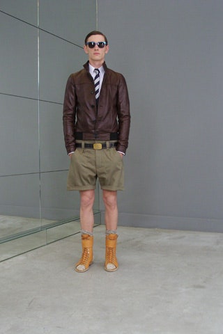 brown leather jacket with beige shorts