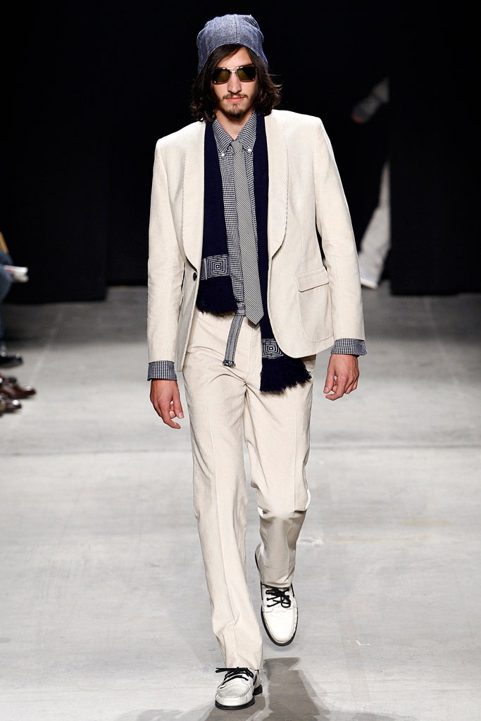 white tailored suit with blue shirt