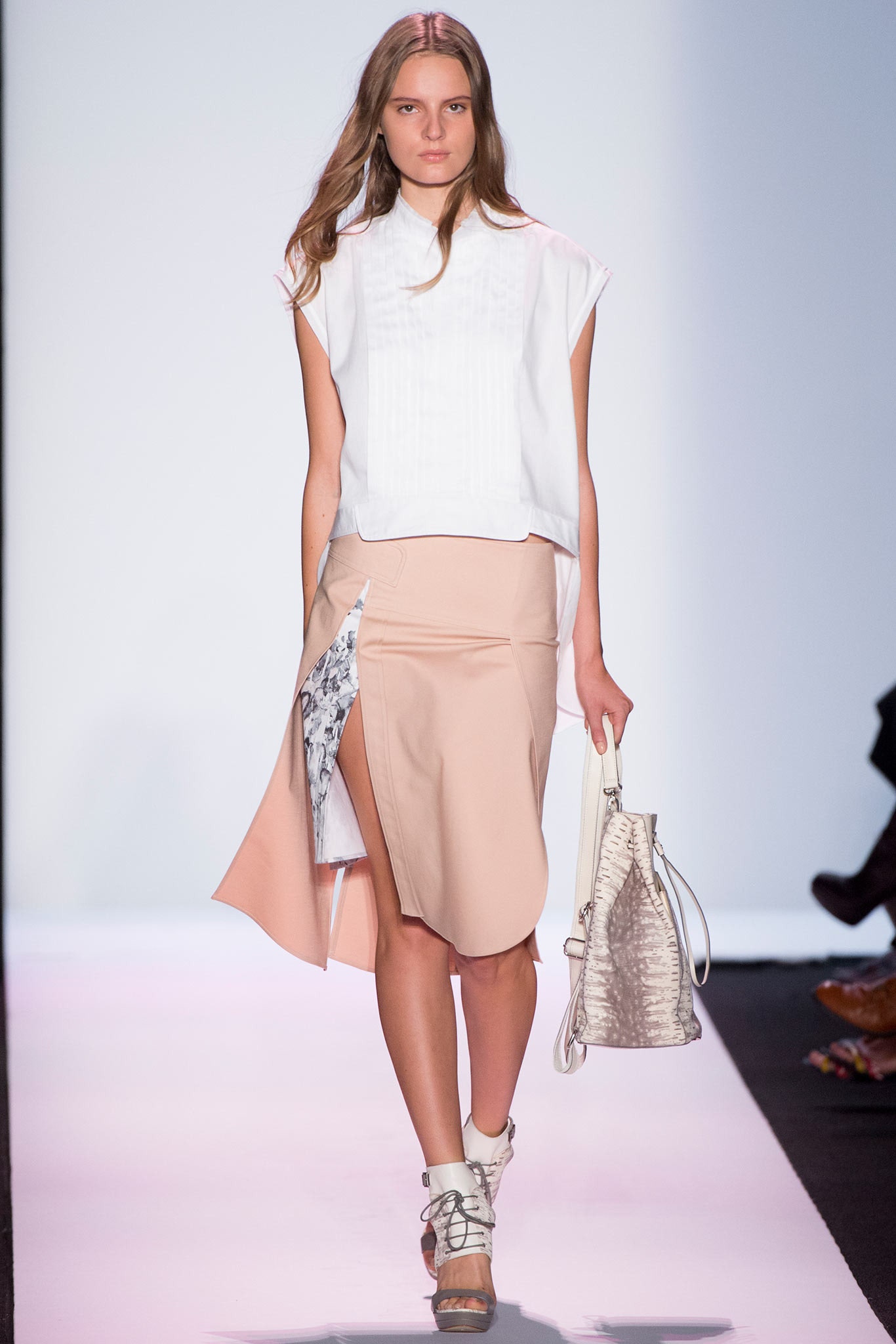 white relaxed top with beige skirt