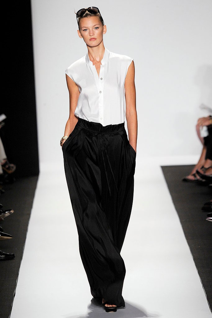 white relaxed shirt and black pleated pants