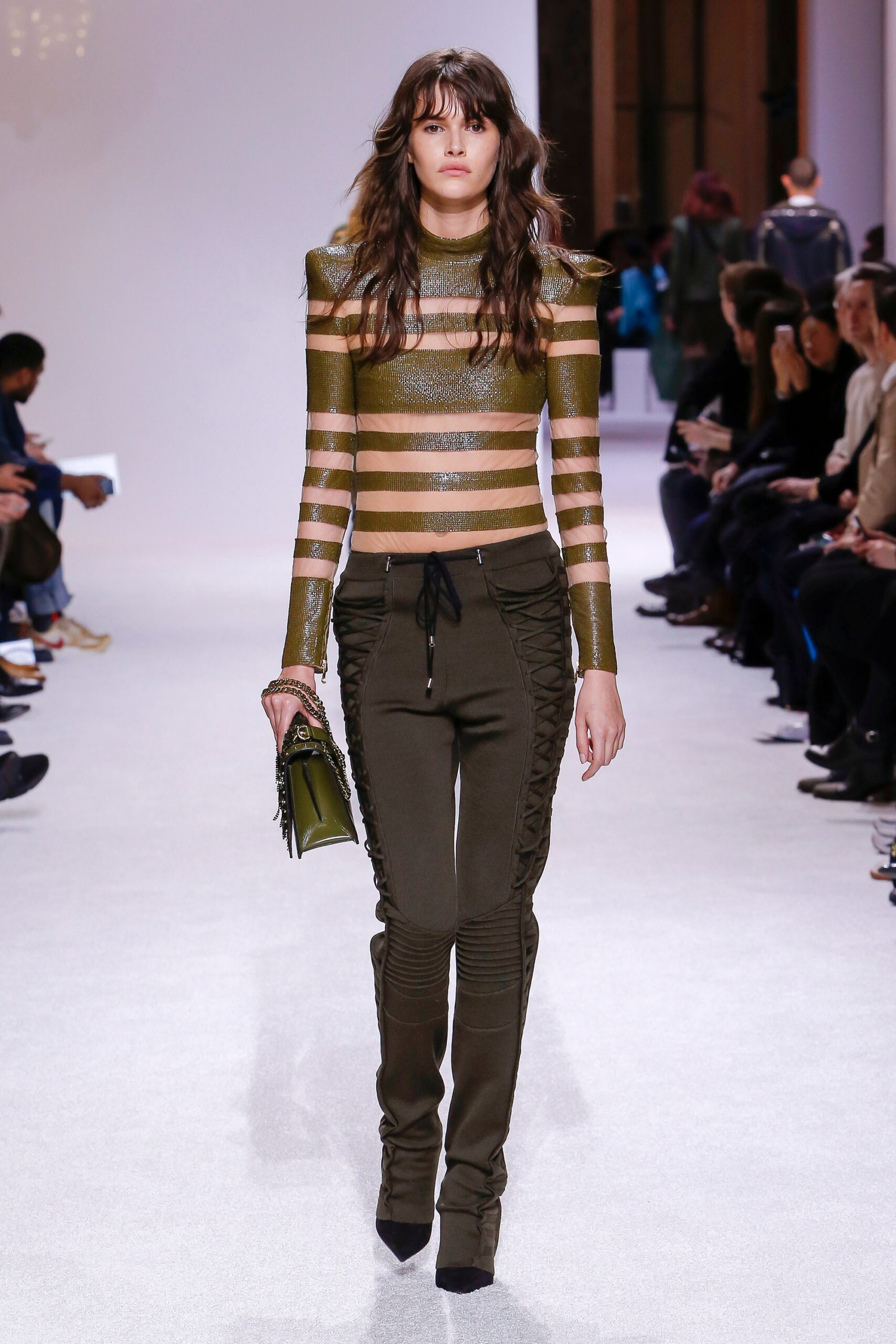 fitted green striped top and black pants