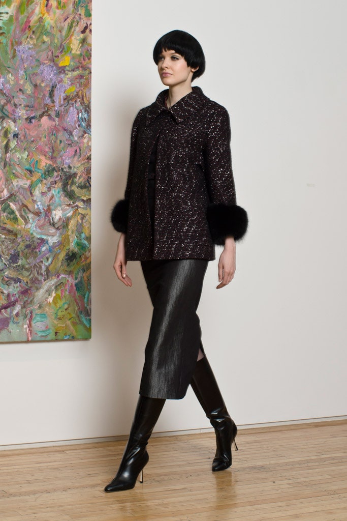 fitted black wool coat and leather skirt
