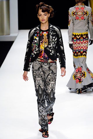 black leather fitted jacket and printed pants