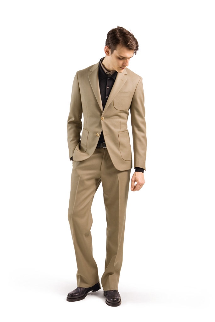 beige tailored suit with black shirt
