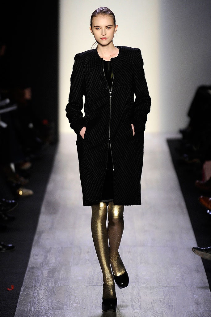 black wool coat with gold leggings
