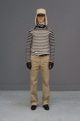 striped turtleneck with beige pants