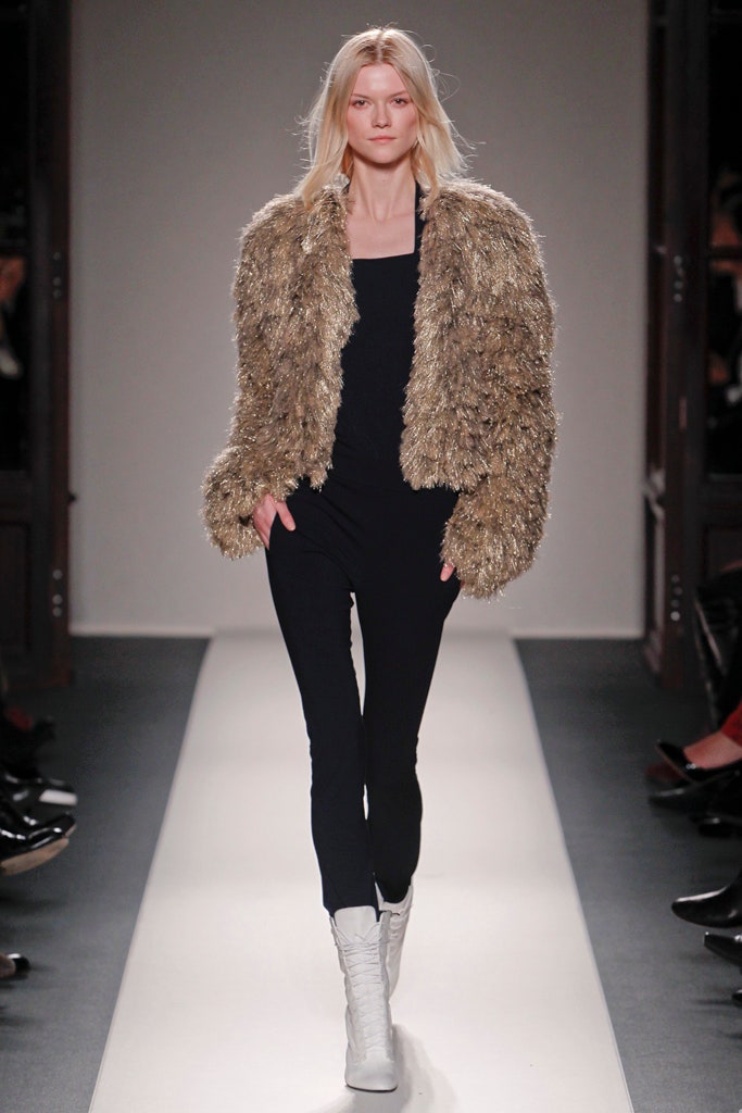 gold fur jacket black top