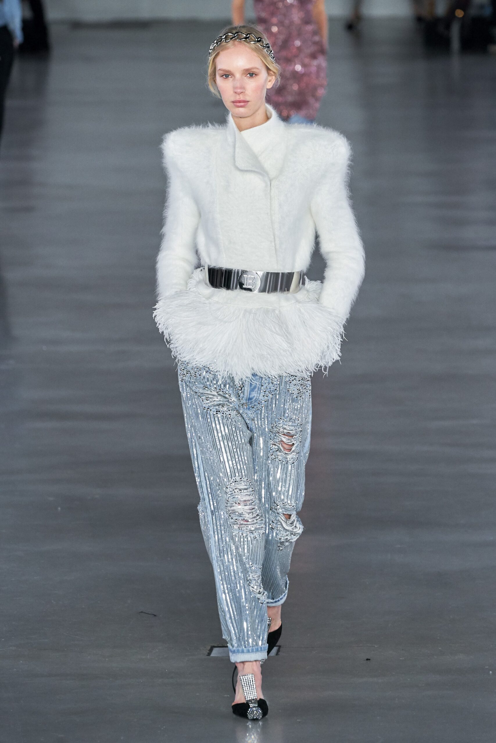 white faux-fur jacket and silver pants