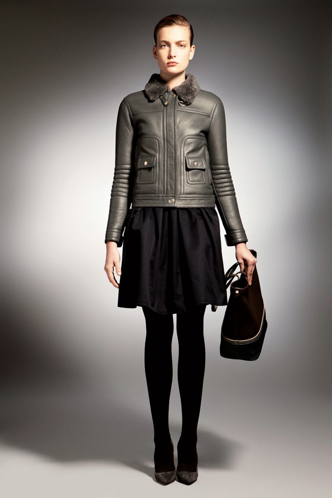 black leather jacket and pleated skirt