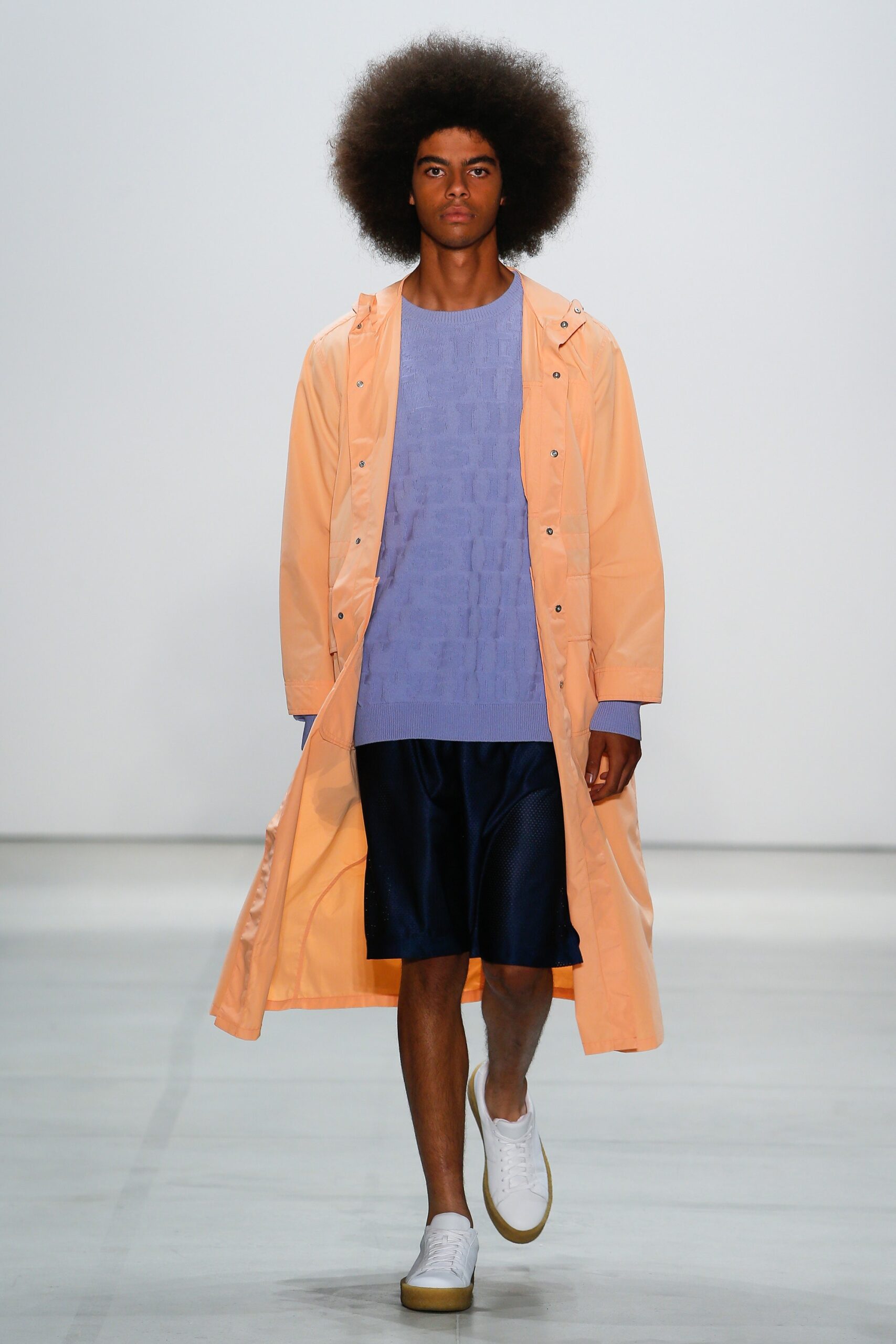 orange vinyl coat with purple sweater