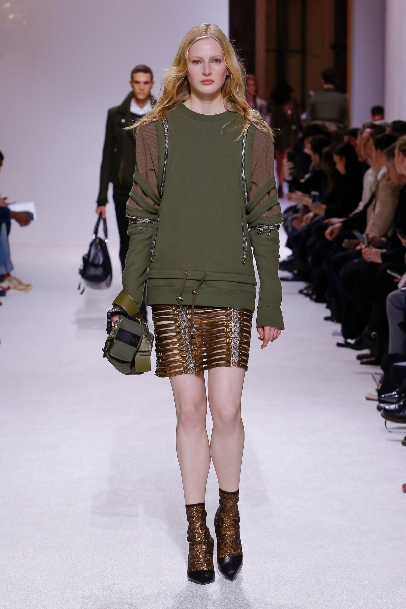 green relaxed top with gold mini skirt