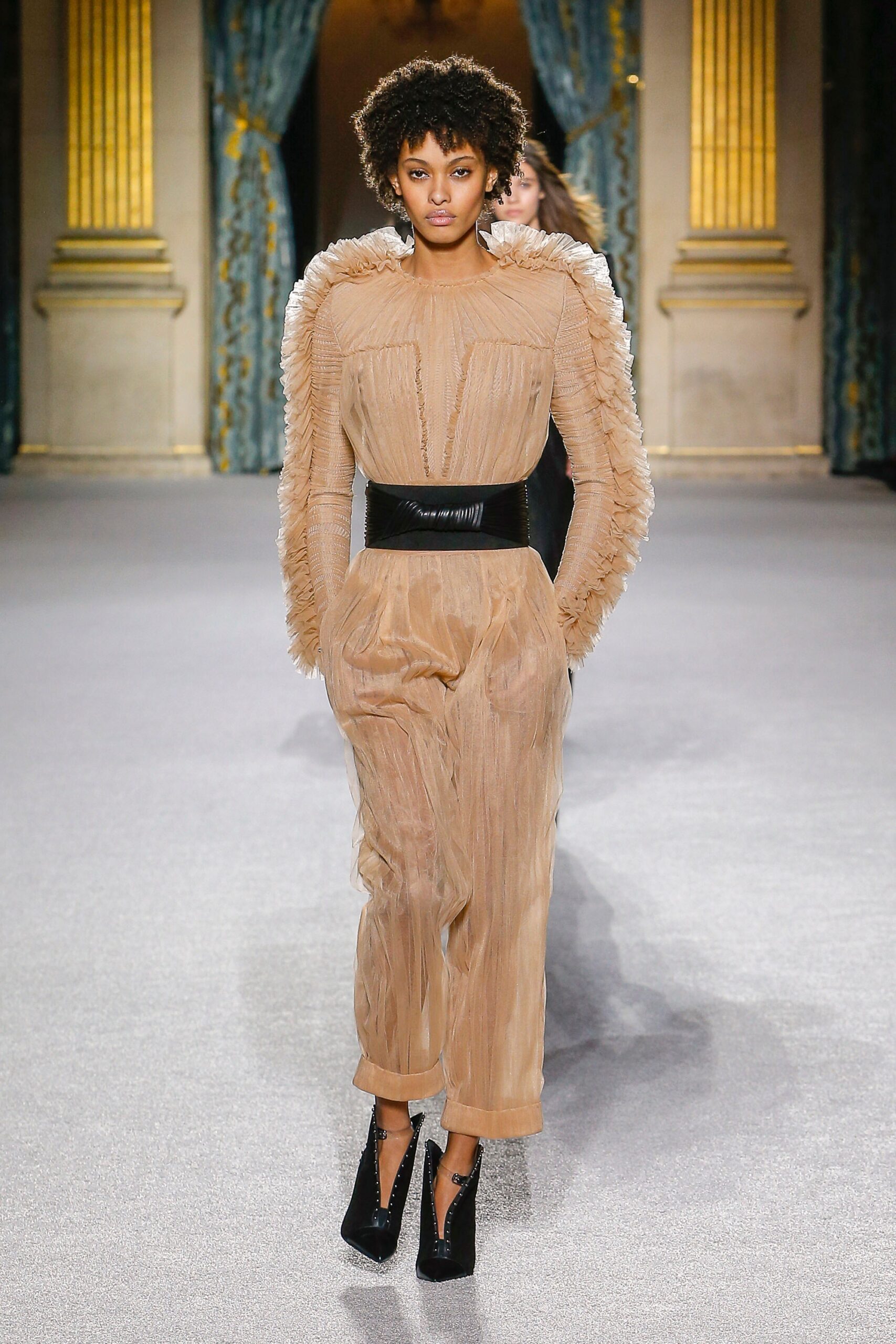 beige pleated jumpsuit with black belt