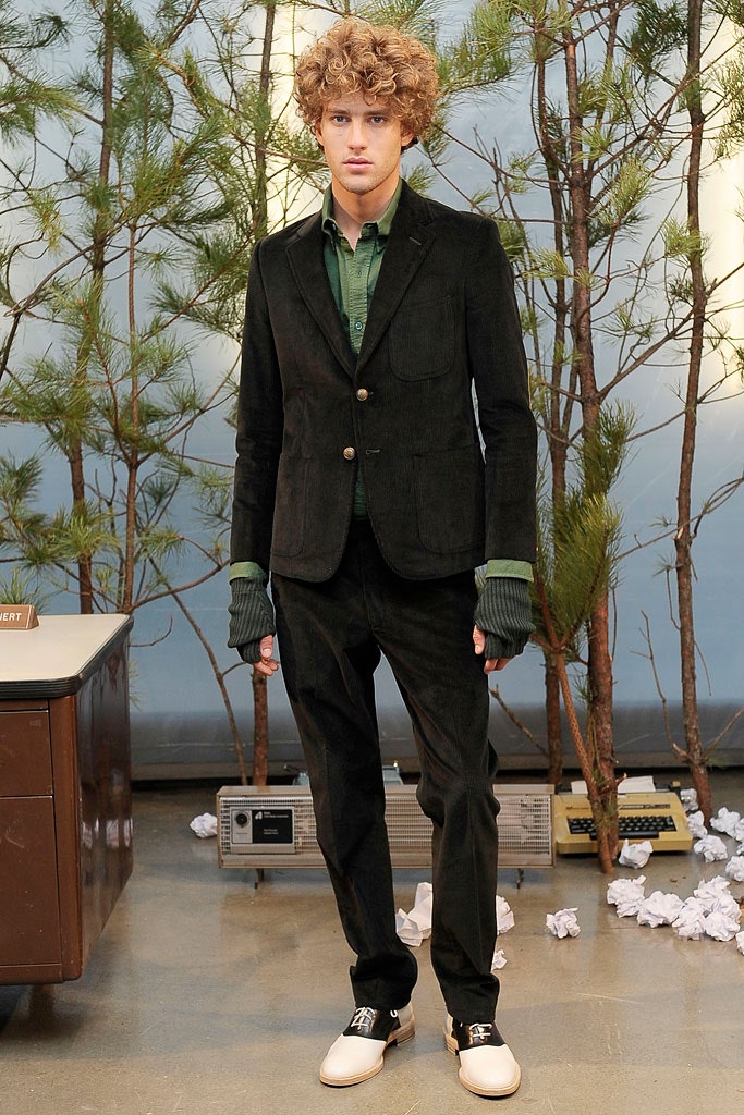 black tailored suit with green shirt