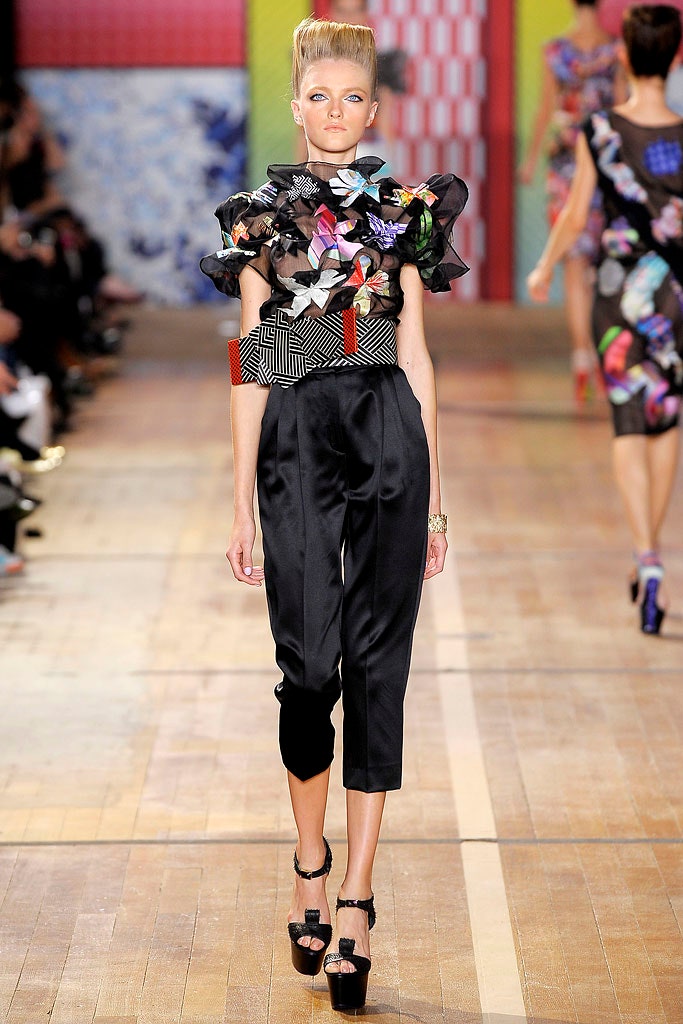 multi-colored ruffled top and black cropped pants