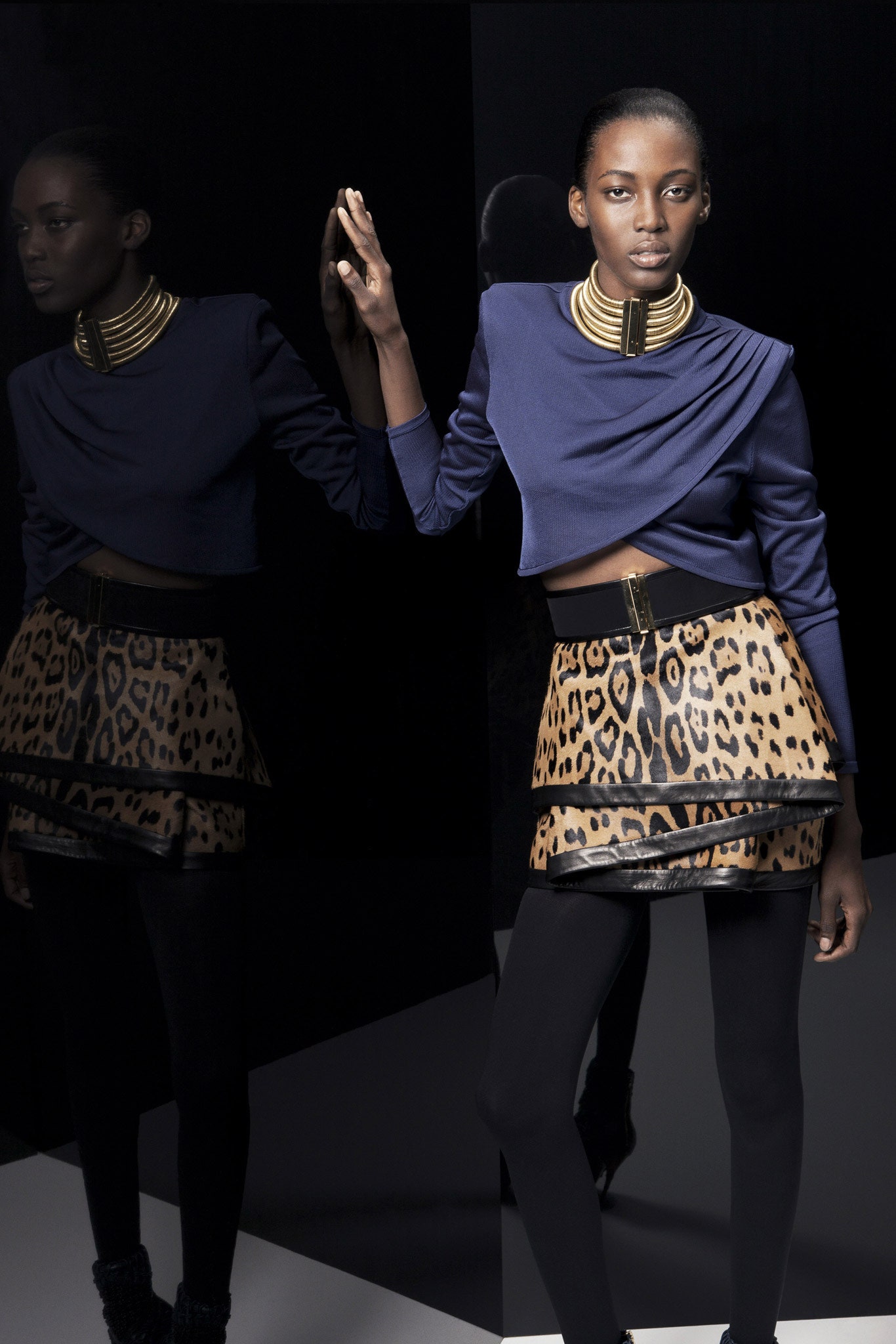 blue fitted top and brown animal-print skirt