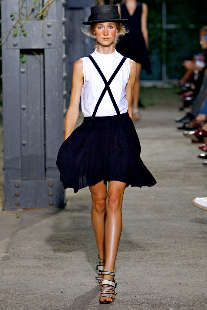 white fitted top black pleated skirt