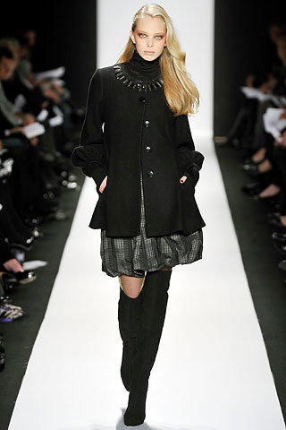 black wool coat with pleated dress
