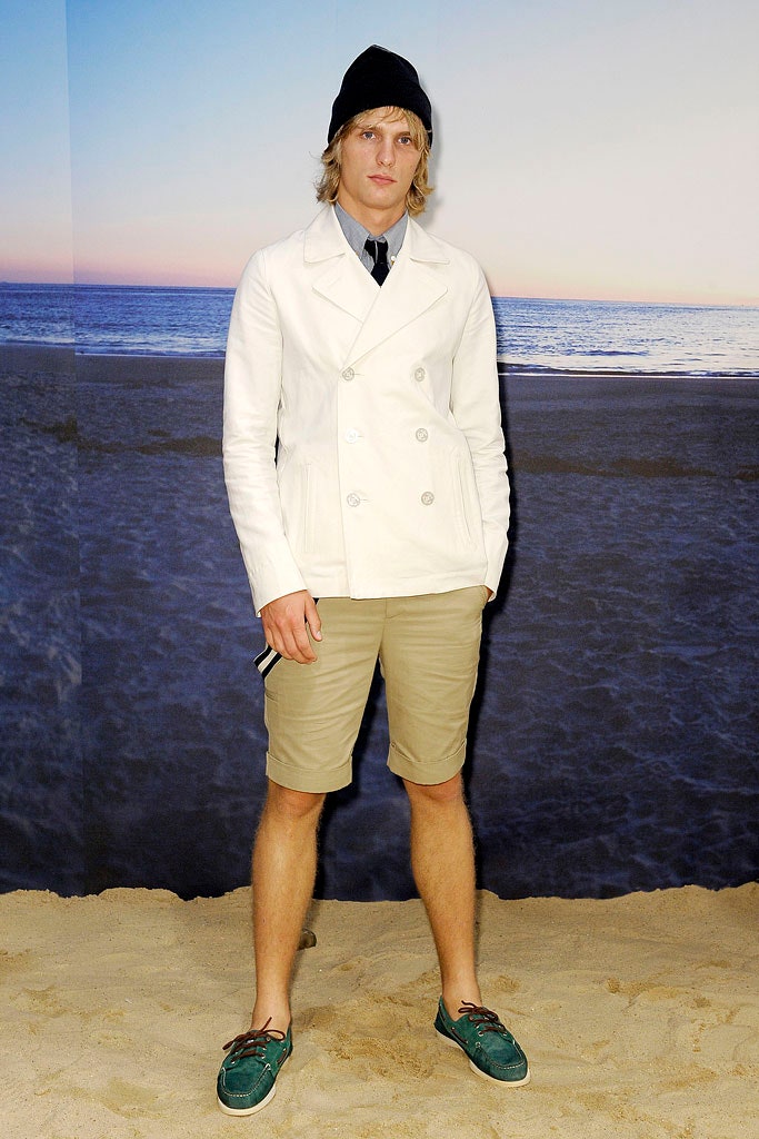 white fitted jacket with beige shorts