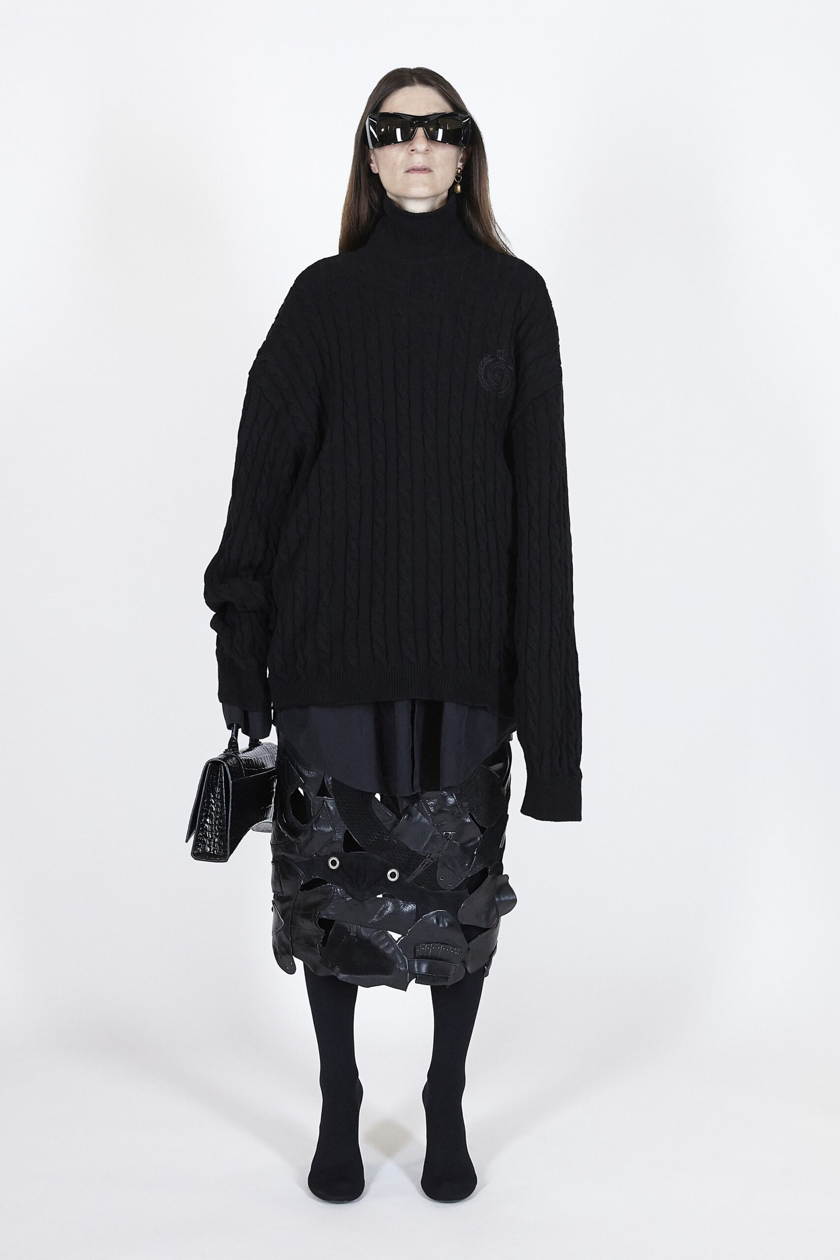oversized black wool sweater and vinyl skirt