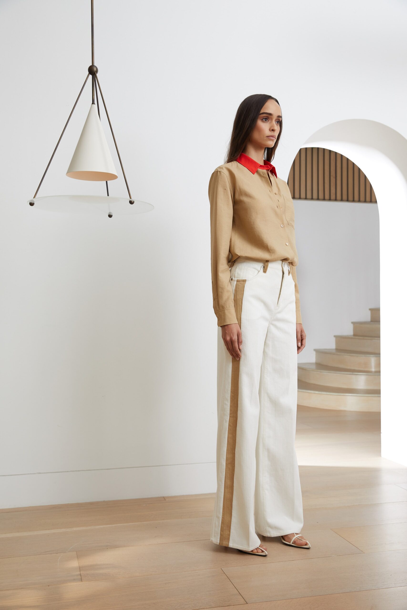 beige shirt with red collar