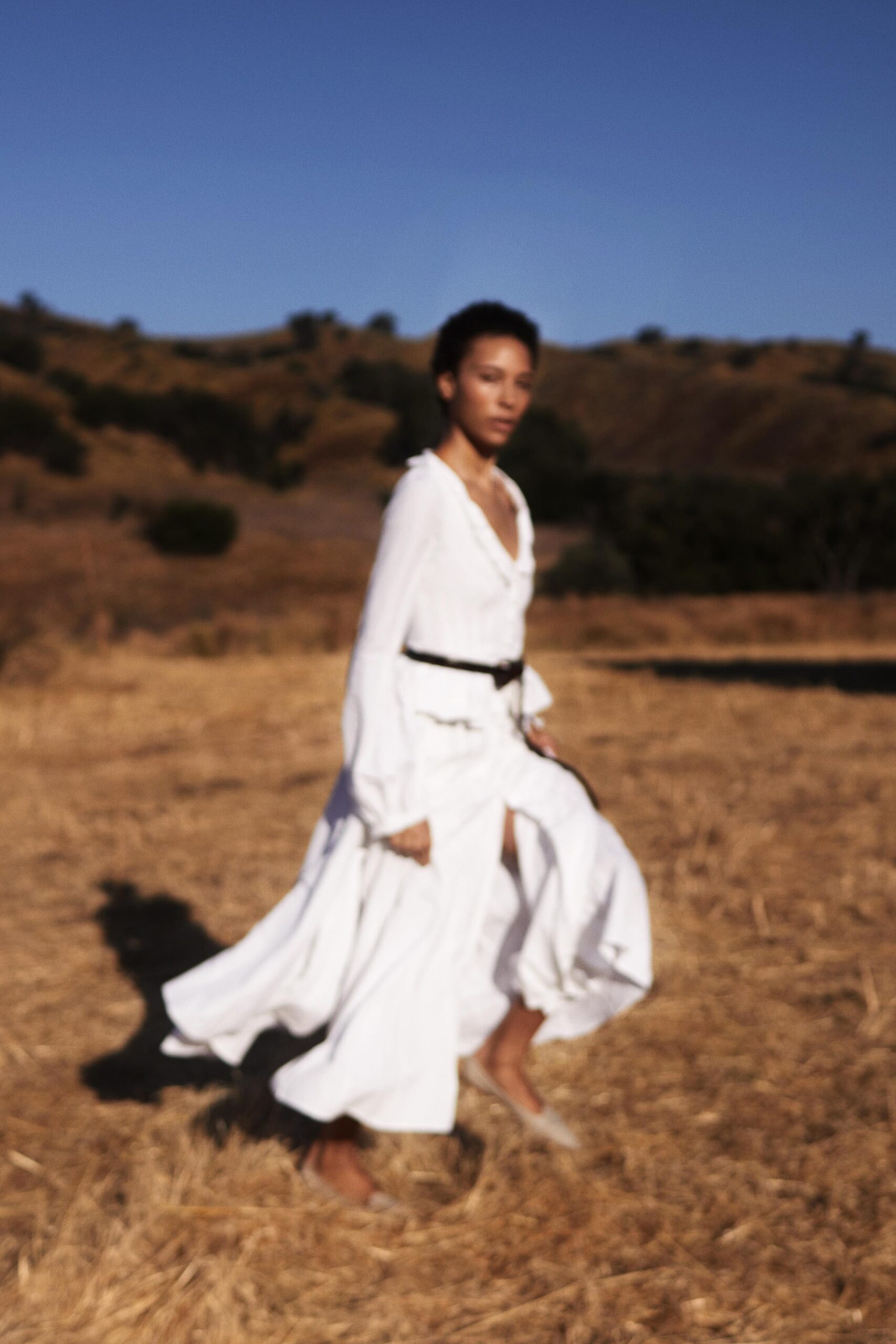 white unknown long-sleeve v-neck belted ruffled flowing maxi-dress