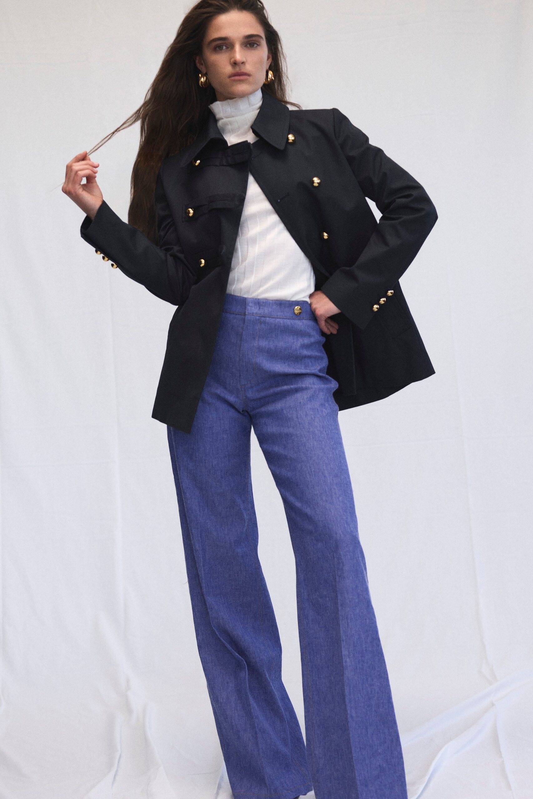 military-style black blazer with gold buttons