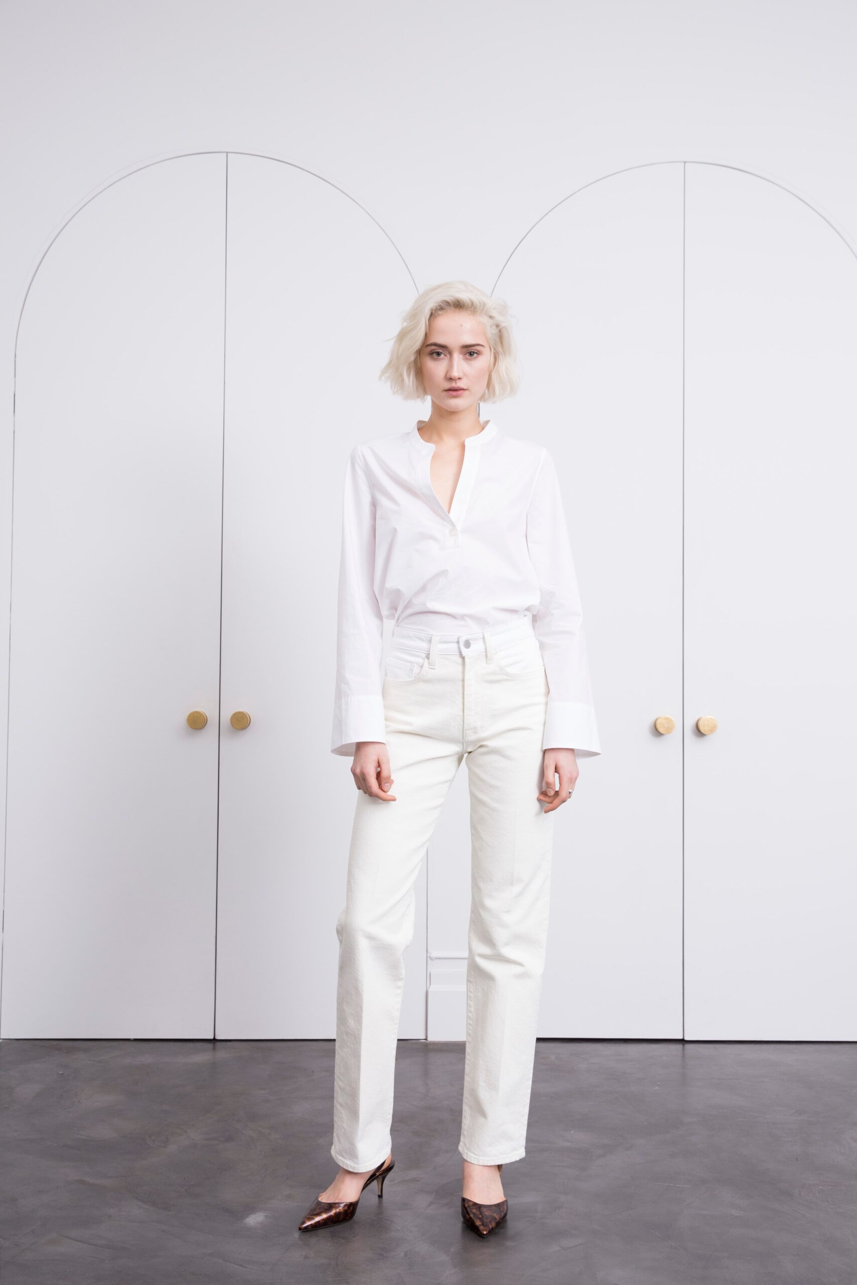 white high-waisted straight-leg jeans