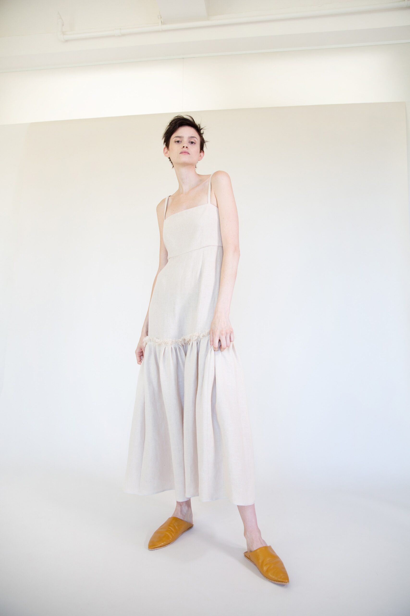 ivory linen sleeveless spaghetti-strap ruffled tiered flowing maxi-dress