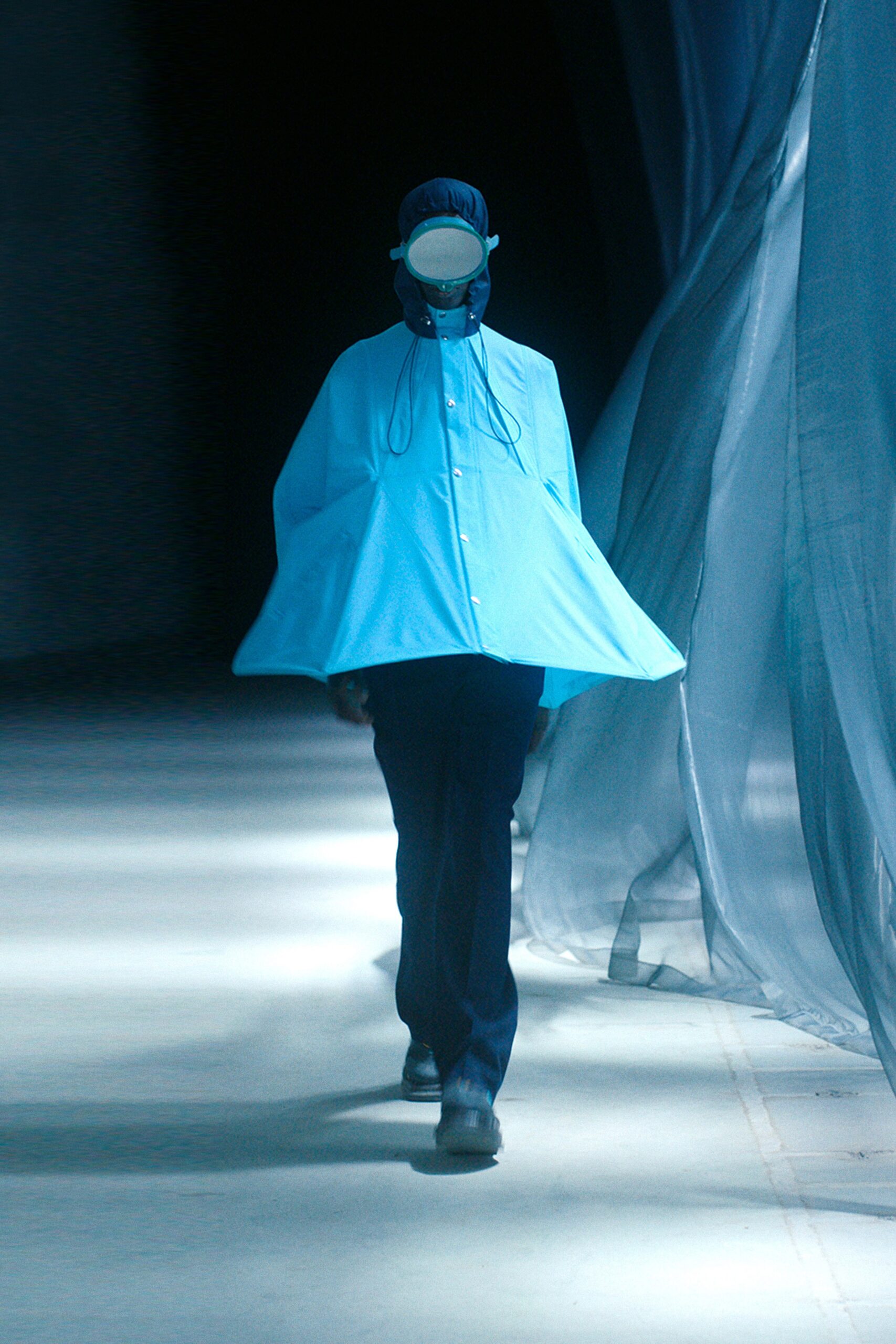 blue high-neck flowing cape