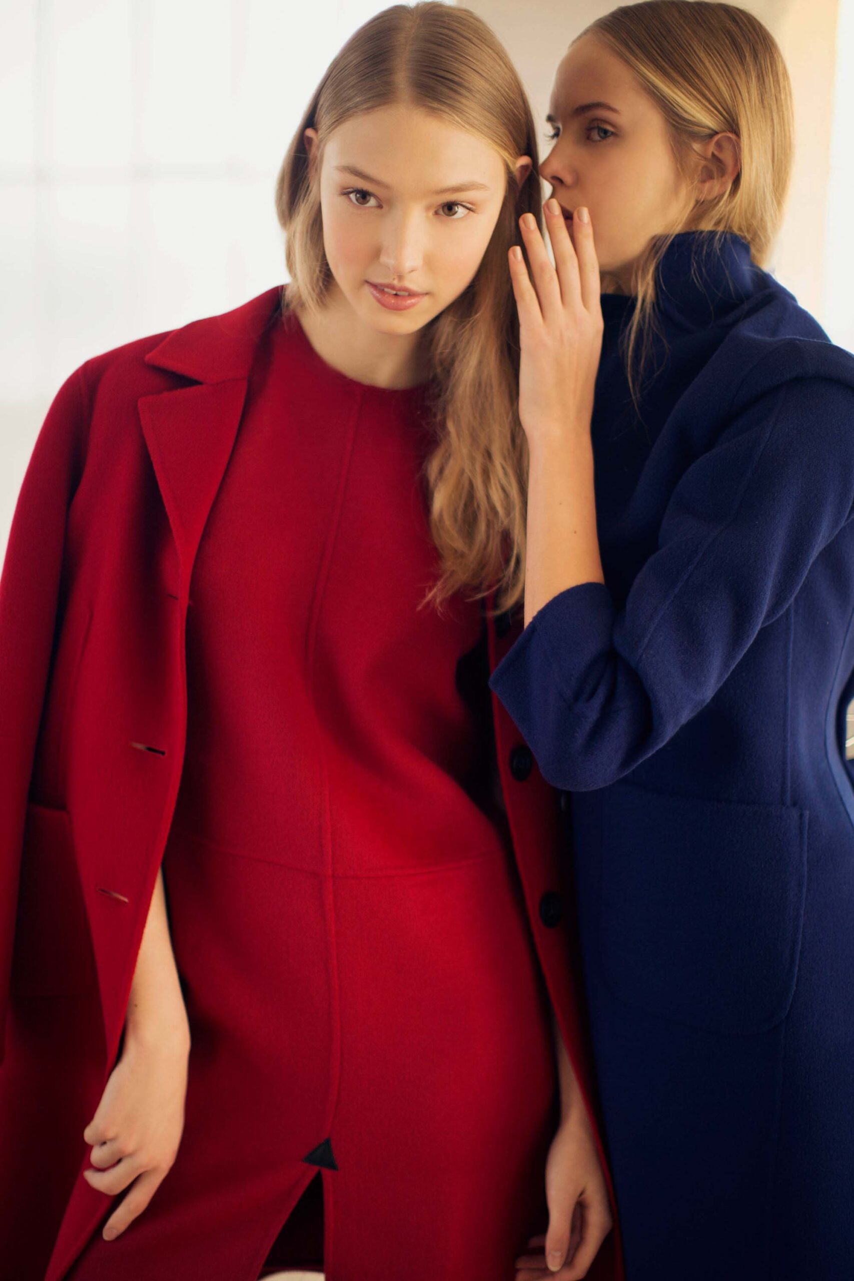 red tailored coat over dress