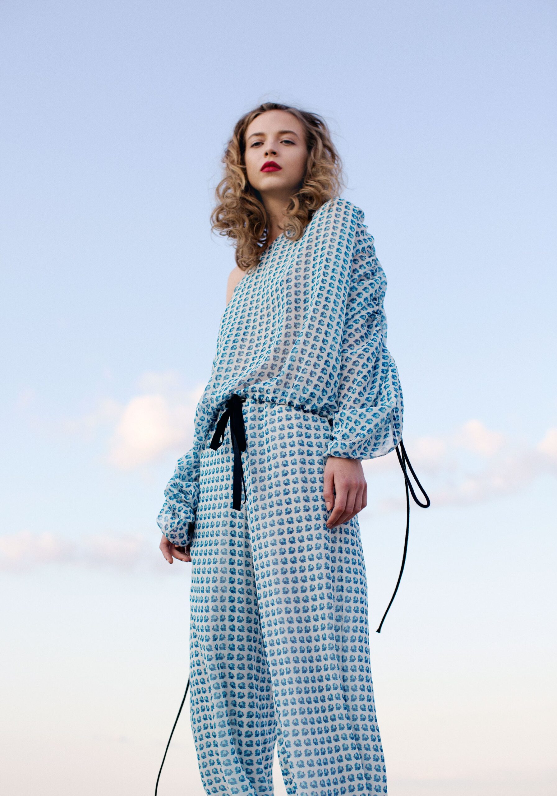 one-shoulder printed draped jumpsuit