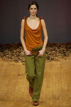 orange draped sleeveless top