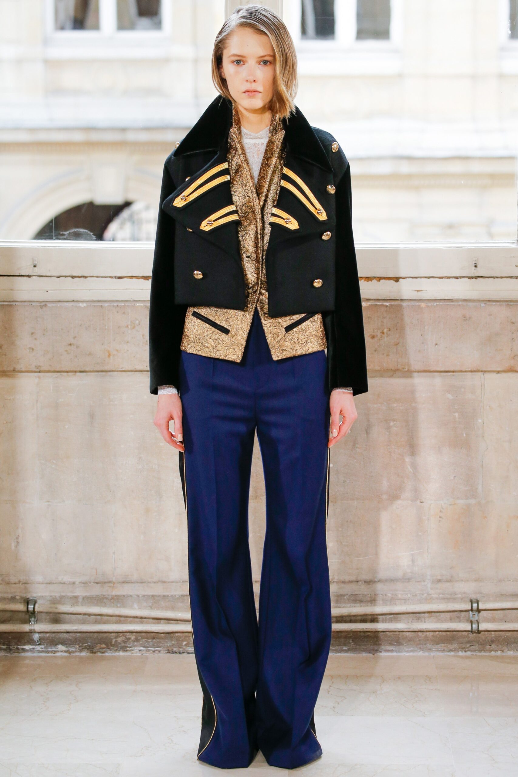 black collared cape with gold trim