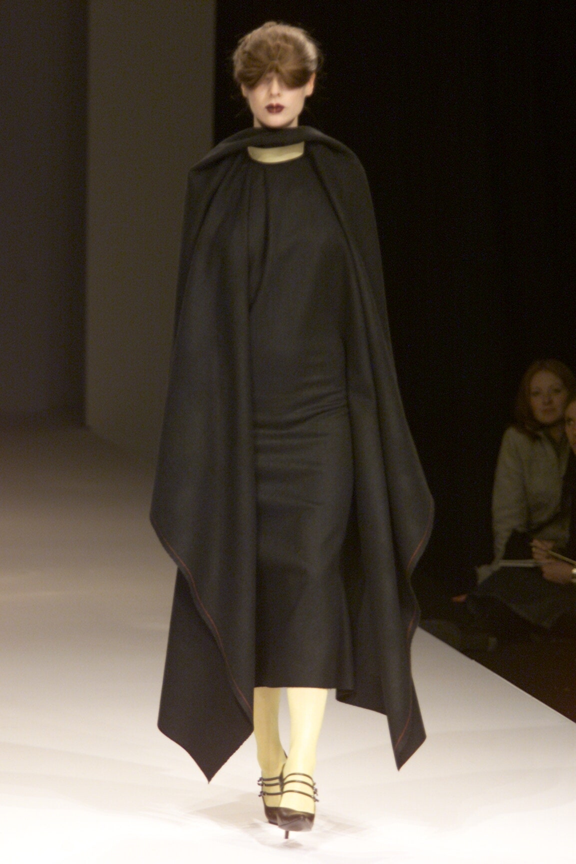 black draped cape over dress