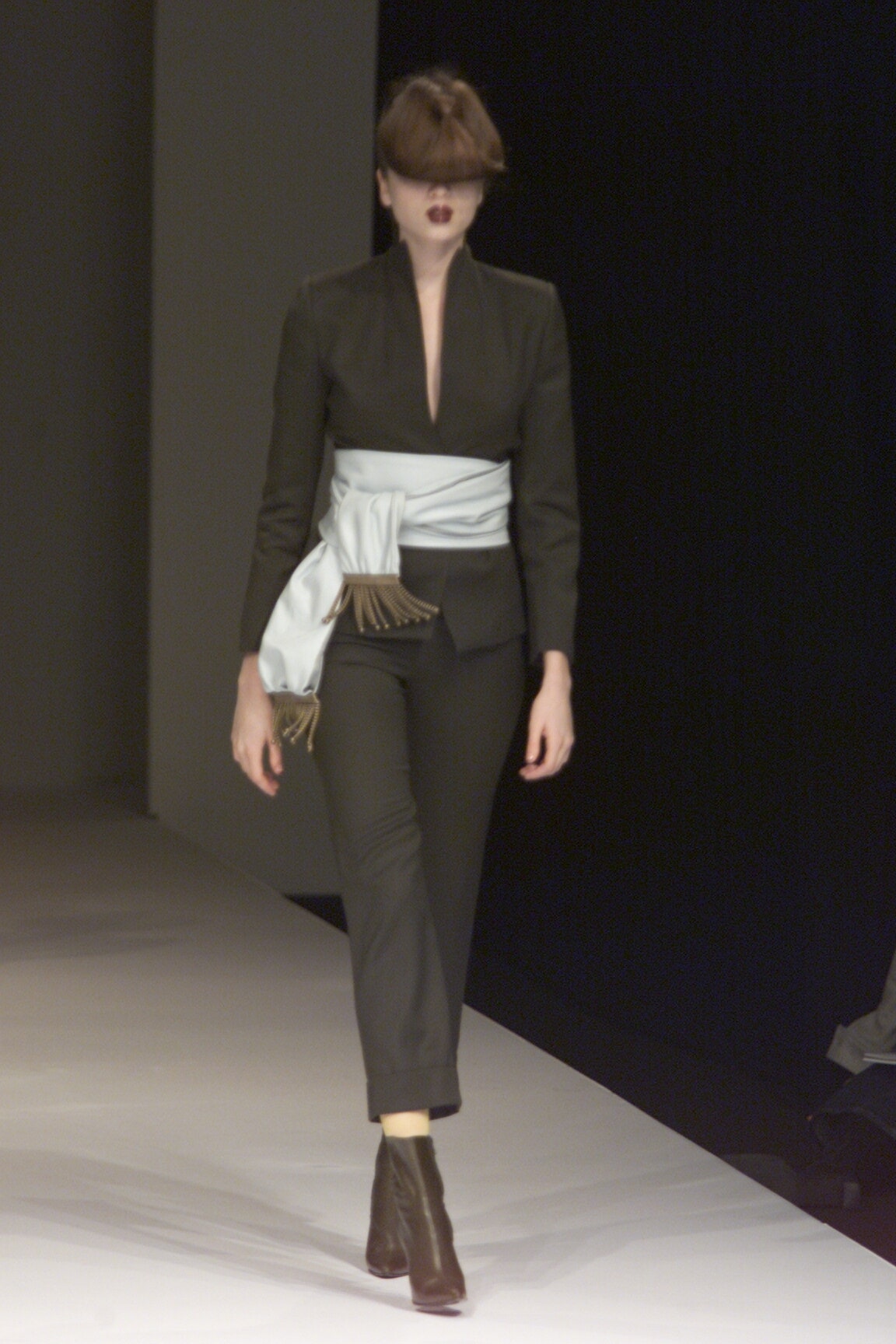 black tailored jacket with blue belt
