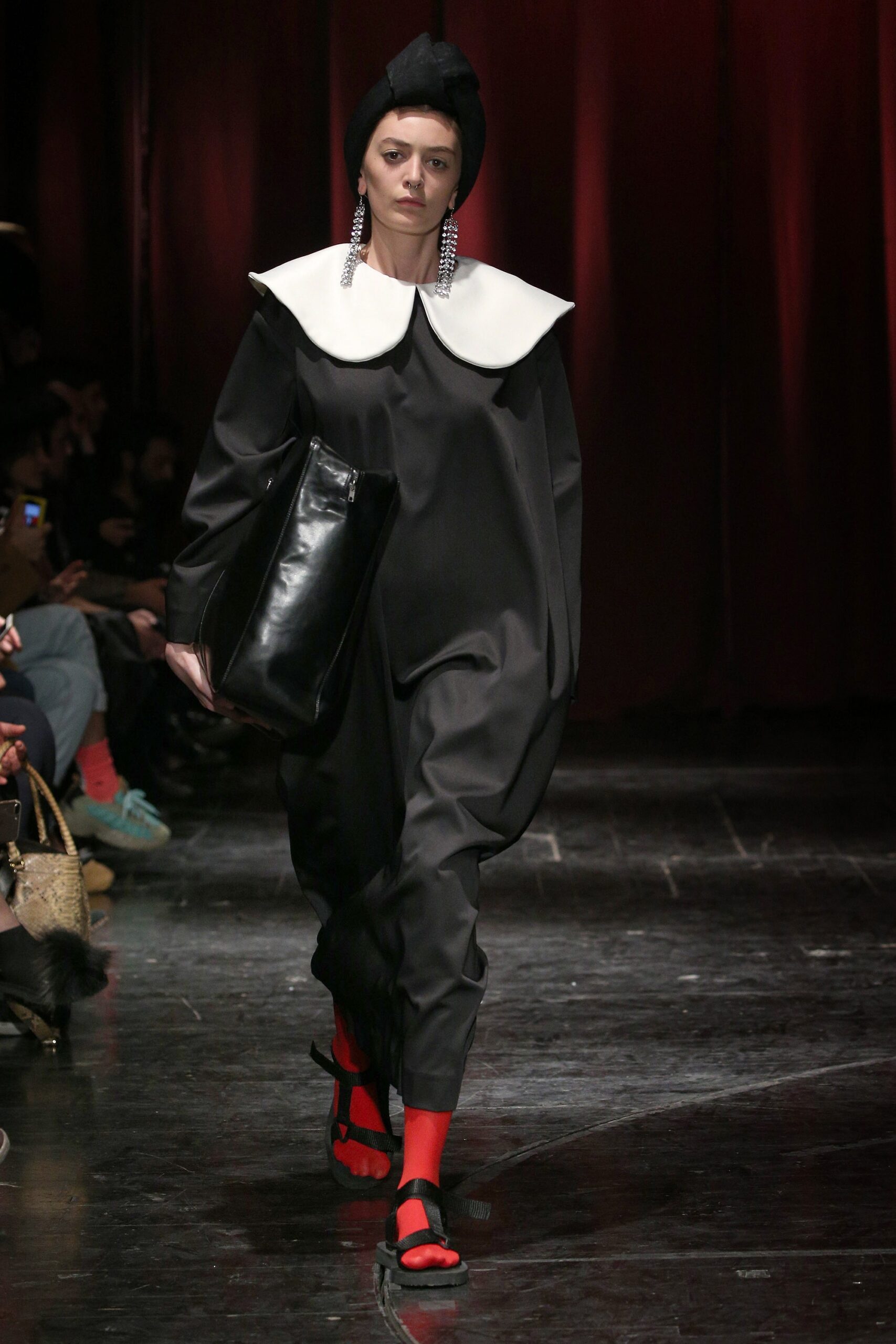 black jumpsuit with white collar