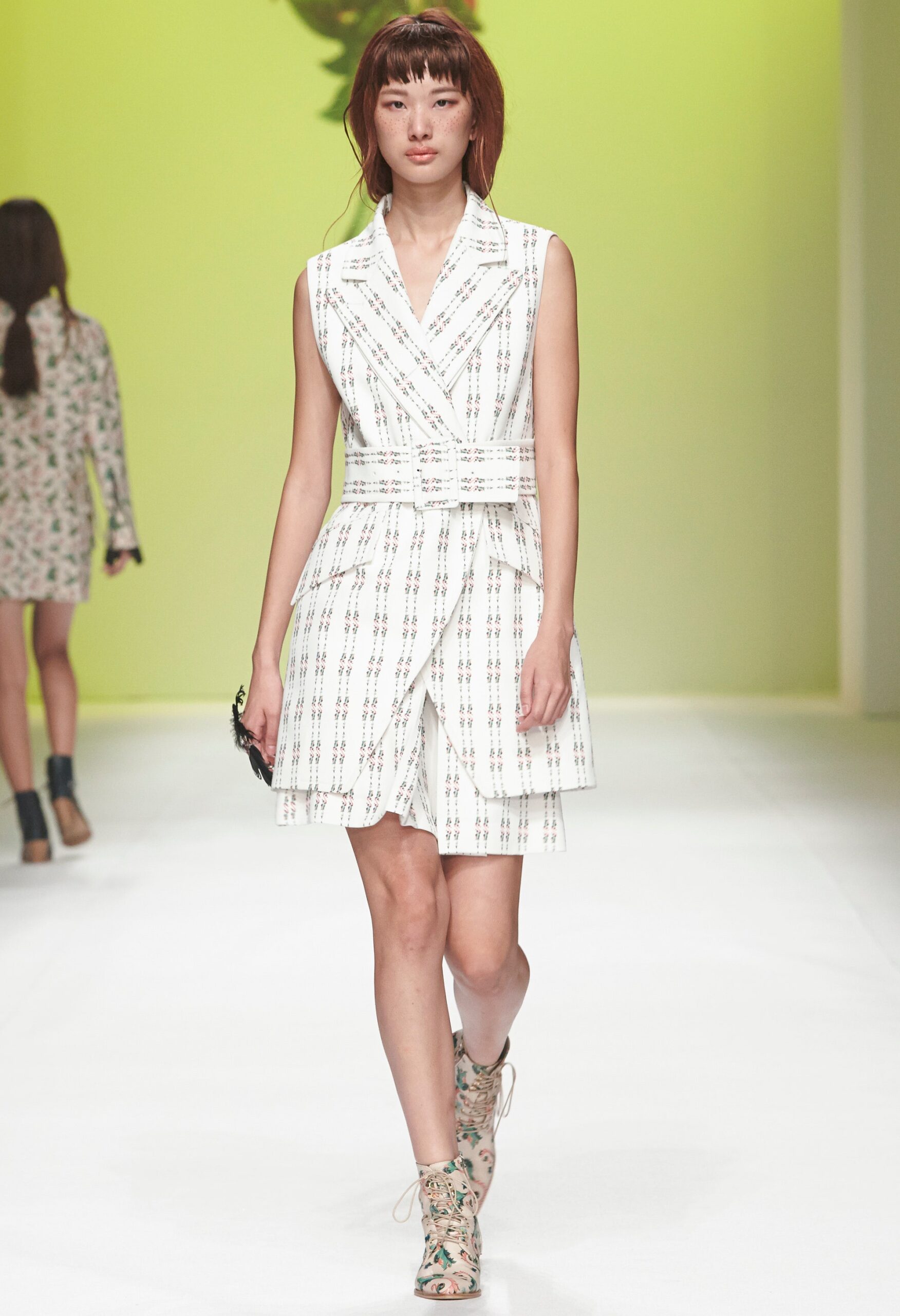 white printed sleeveless wrap dress