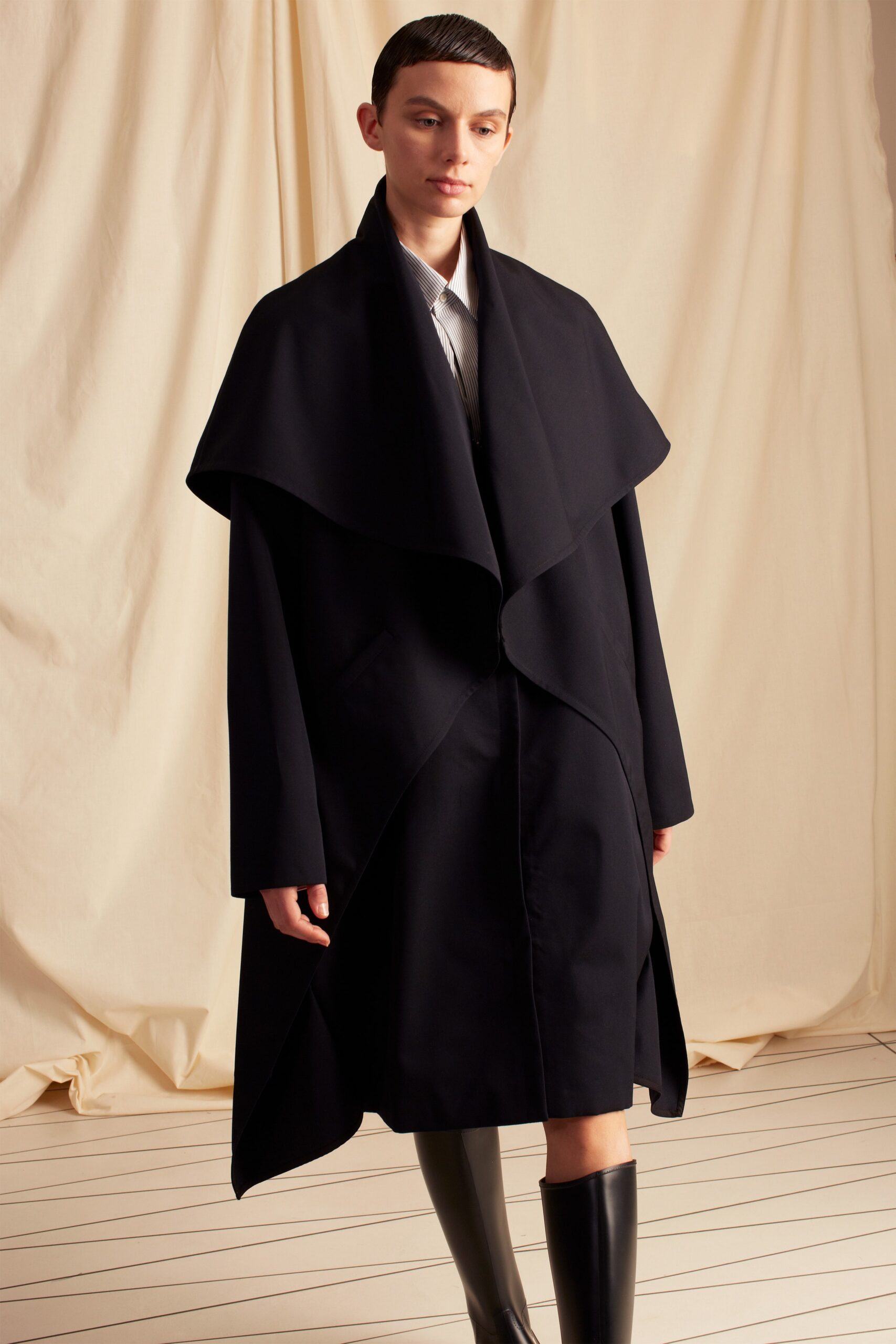 black cape-overlay coat