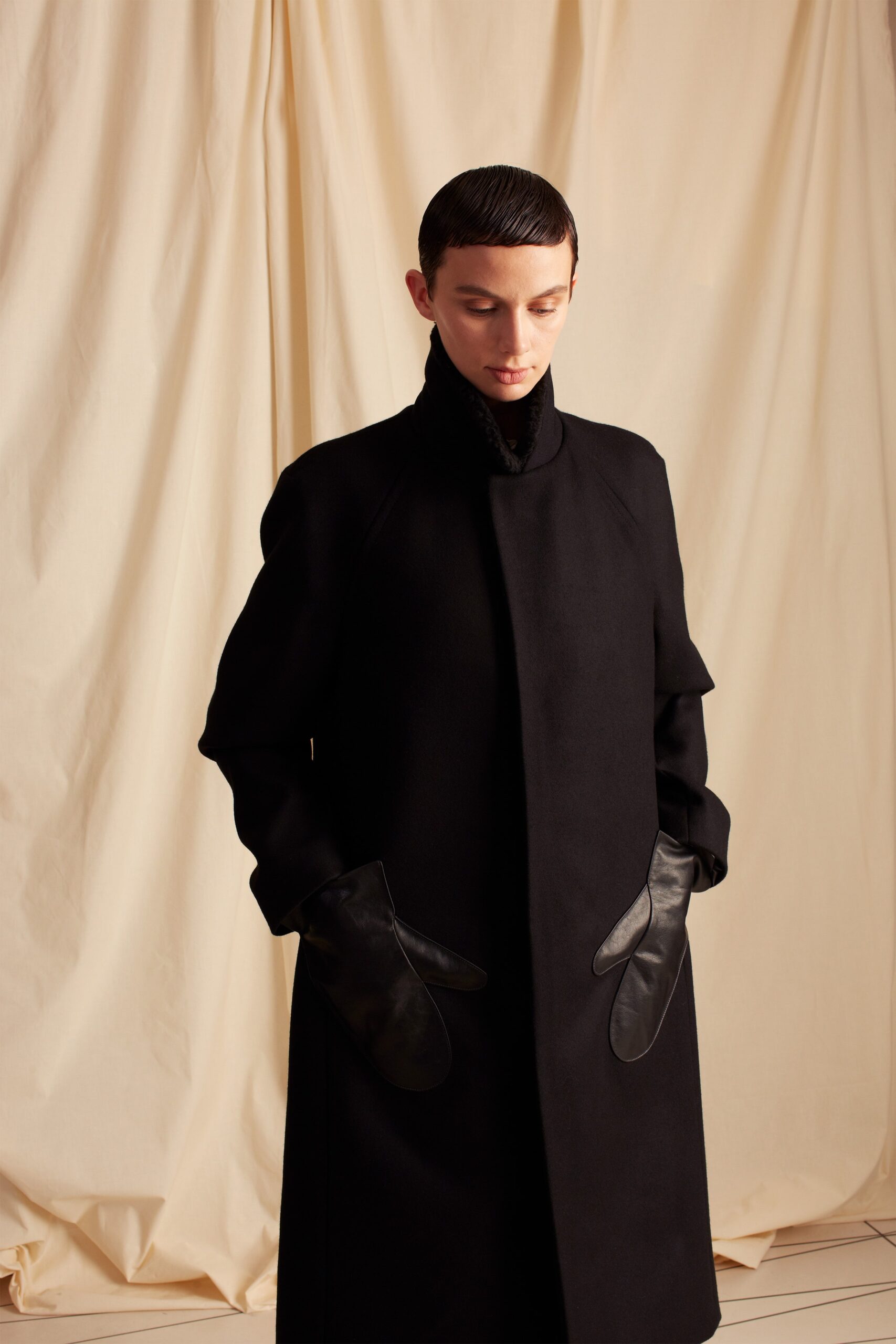 high-neck black wool coat