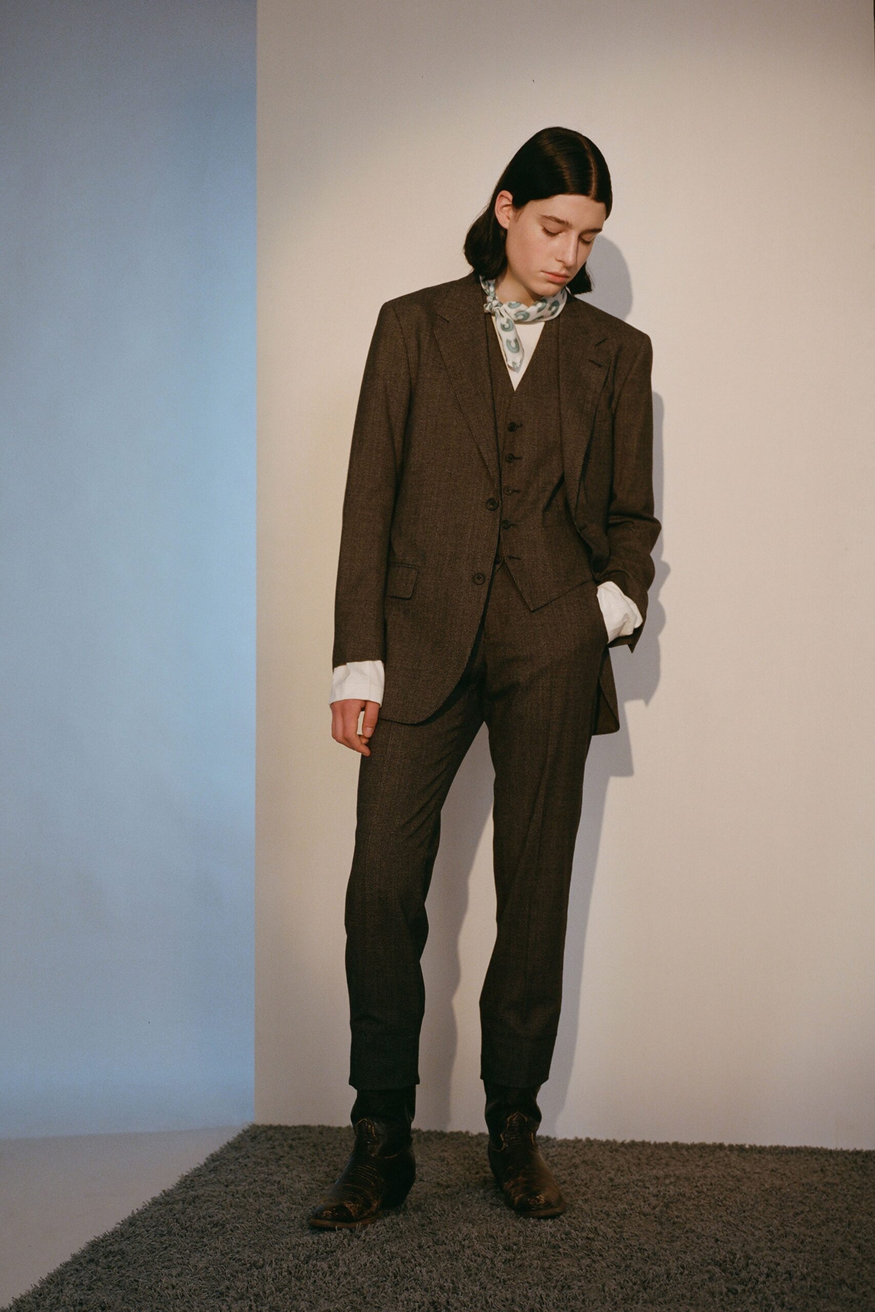 brown tailored three-piece suit
