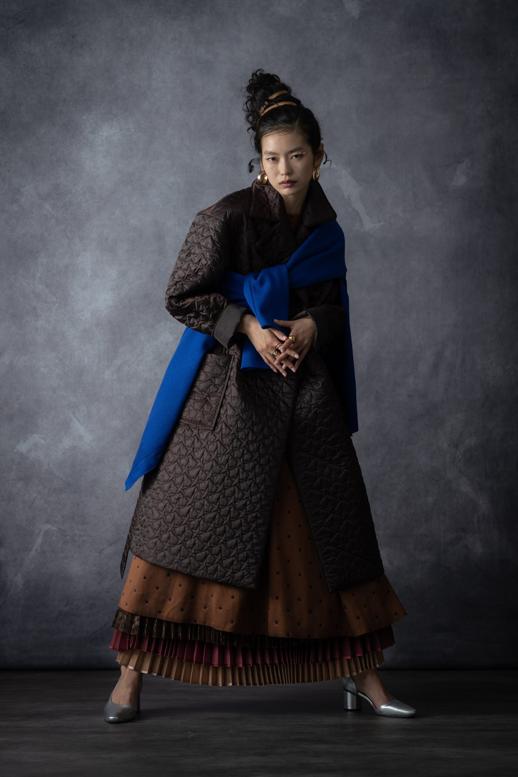 brown nylon long-sleeve collared structured quilted textured coat