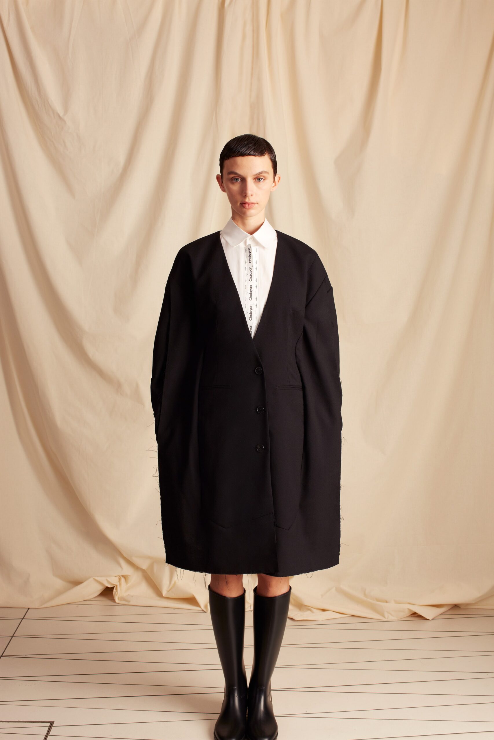 black collarless oversized overcoat