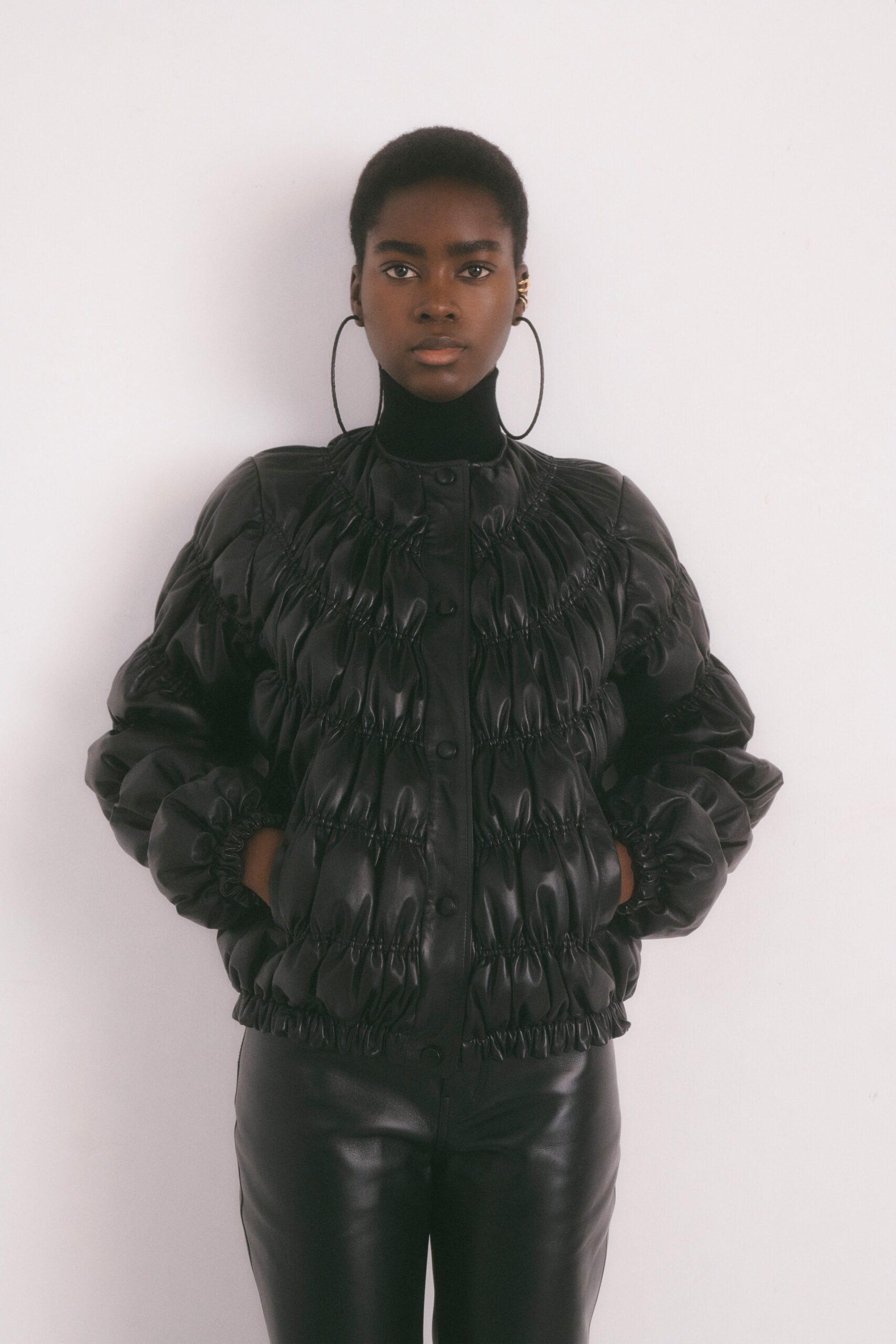 black leather long-sleeve high-neck oversized ruched buttoned jacket