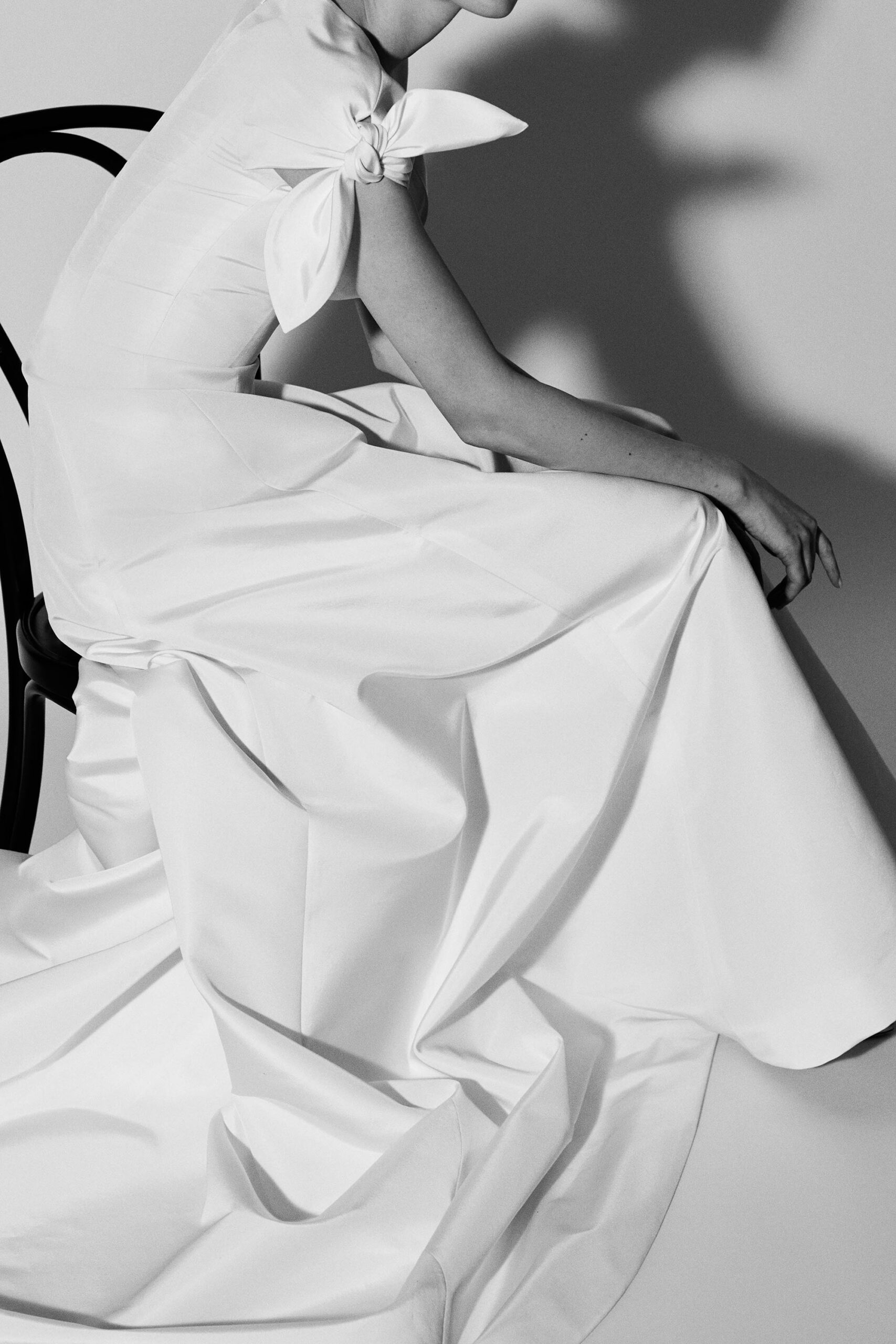 white bow-sleeve evening gown