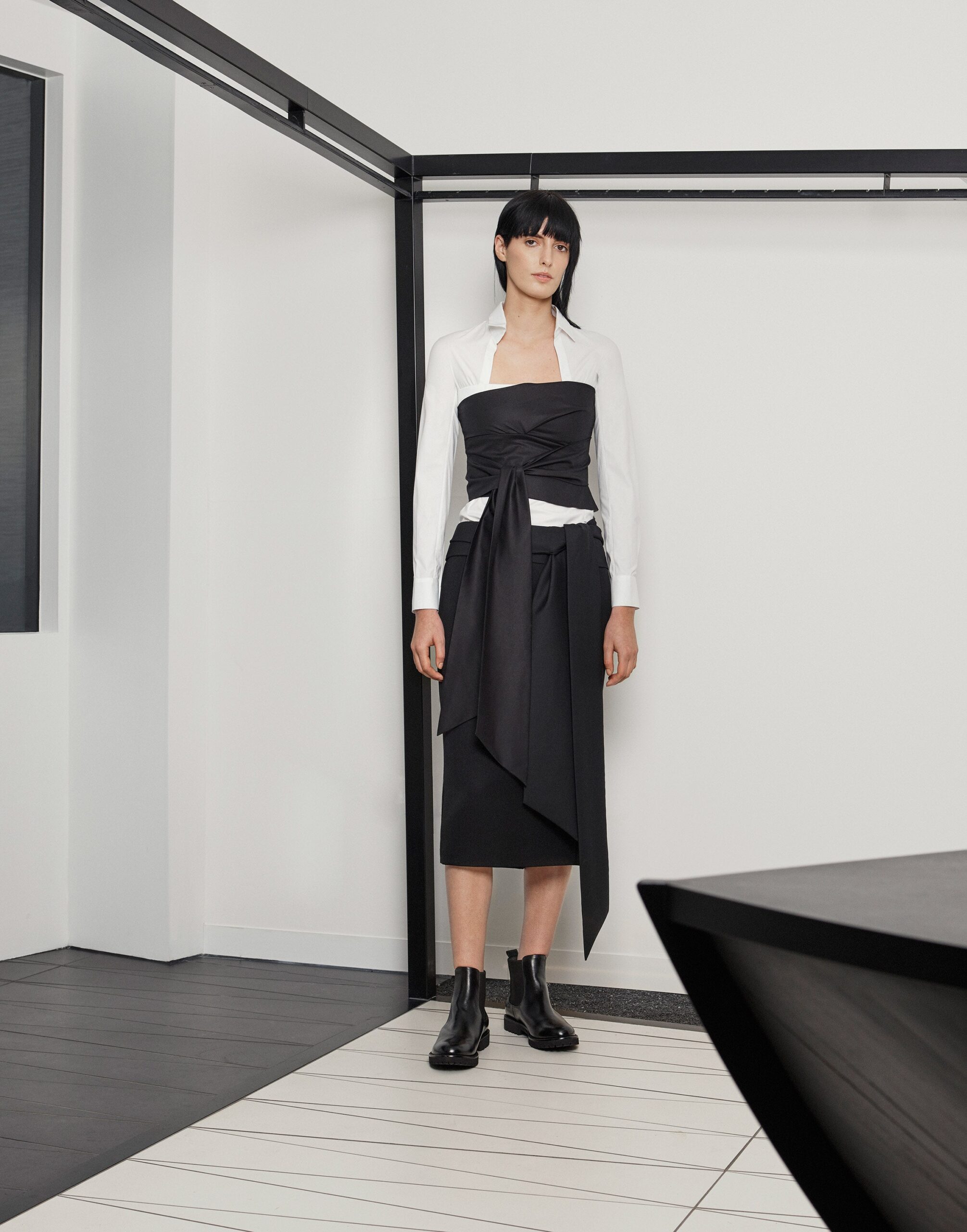 black strapless bustier over white shirt