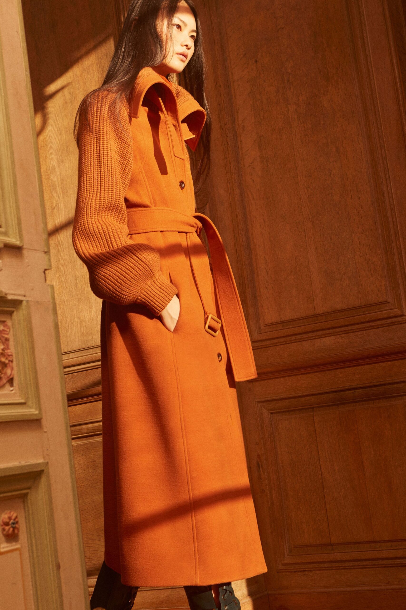 orange knit long-sleeve collared tailored belted buttoned coat